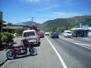The main street with my motorcycle and the ever present New Zealand dairy across the road